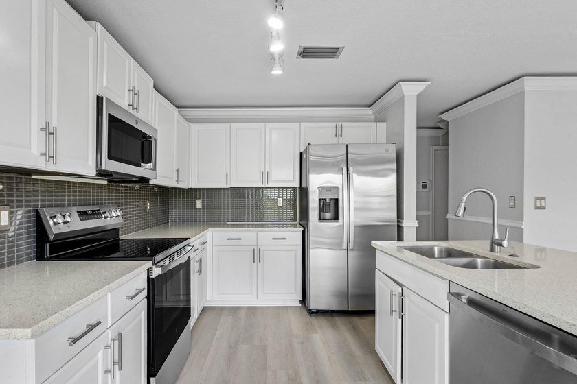 Welcome to 3260 Commodore Court, a beautifully renovated lake - photo 11