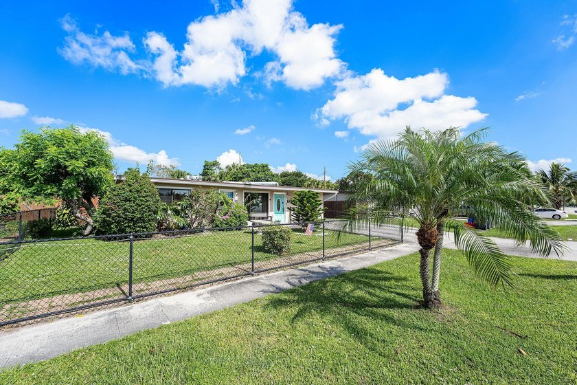 4BR/2BA single-family home with 1,707 sq. ft. under air. This - photo 2