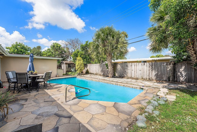 4BR/2BA single-family home with 1,707 sq. ft. under air. This - photo 10