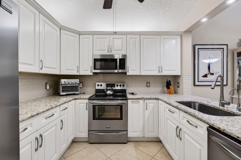 Enjoy breathtaking lake views from this beautifully maintained - photo 17