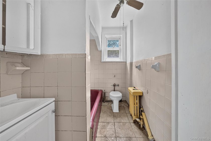 Solid brick home offering endless potential! Features include a - photo 13