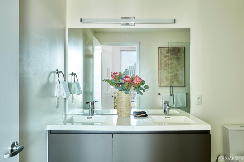 Situated on the 11th floor, this luminous two-bedroom, two-bath - photo 13