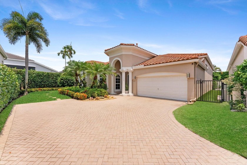 Nestled within the prestigious Woodfield Country Club, this - photo 2