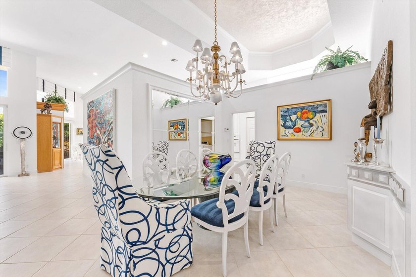 Nestled within the prestigious Woodfield Country Club, this - photo 8