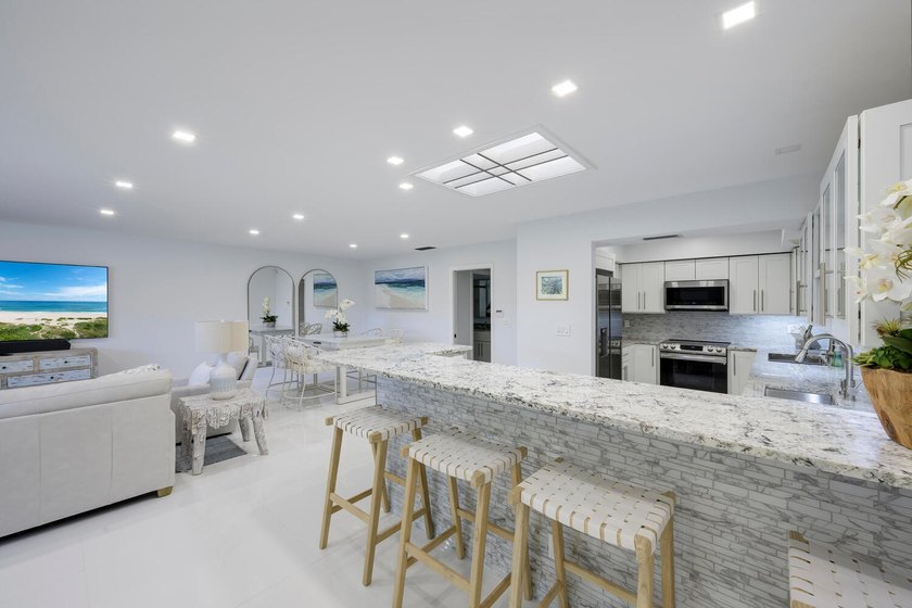 This beautiful home boasts two bedrooms and two baths, with the - photo 4