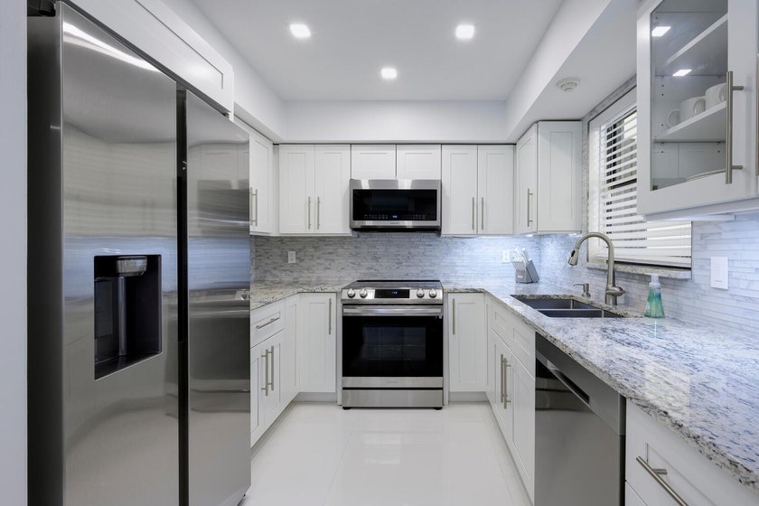 This beautiful home boasts two bedrooms and two baths, with the - photo 5