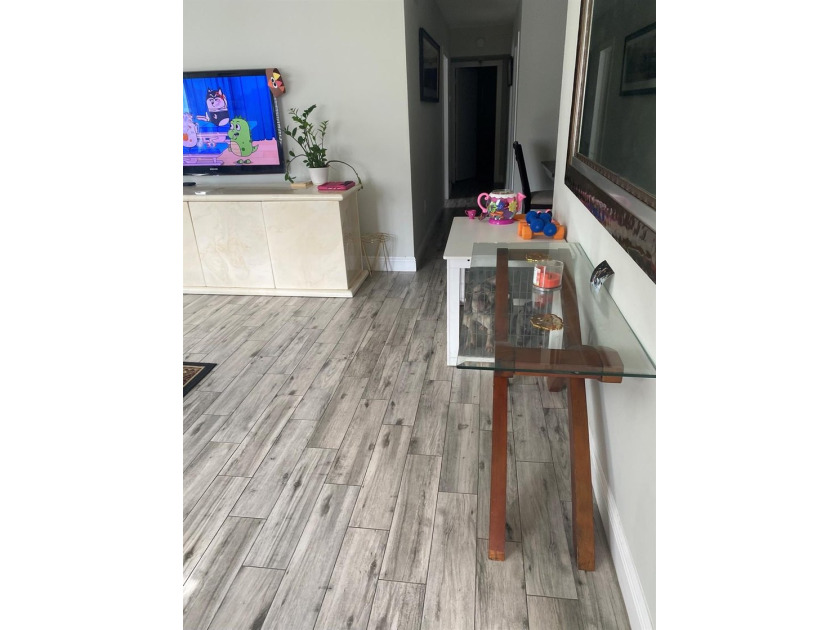 Welcome to this charming 3-bedroom, 2-bathroom condominium - photo 4