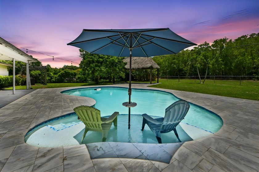 Welcome to 7635 Oakmont Drive in Lake Worth, a charming - photo 3