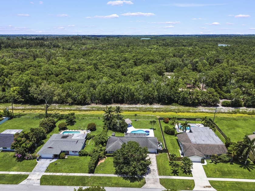Welcome to 7635 Oakmont Drive in Lake Worth, a charming - photo 4