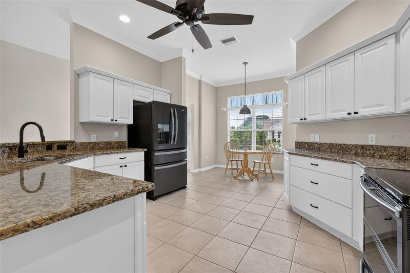 Nestled on a LARGE CORNER LOT in the highly coveted village of - photo 11