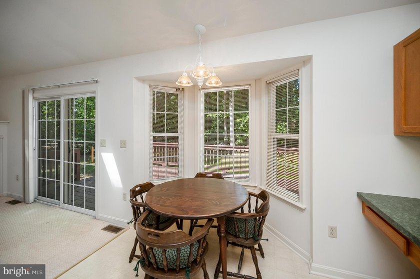 Nestled among mature green trees in the gated Lake of the Woods - photo 14