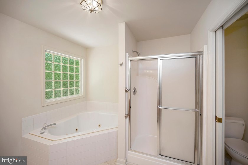 Nestled among mature green trees in the gated Lake of the Woods - photo 24