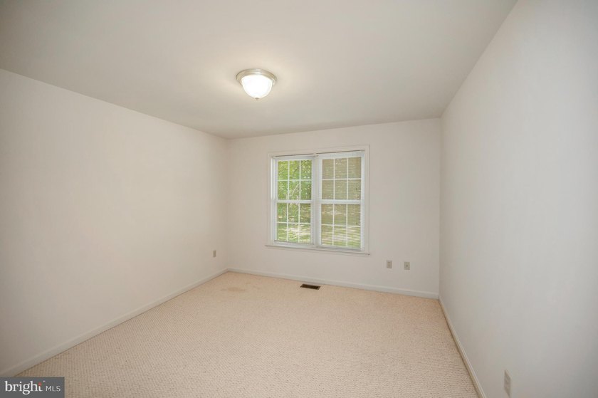 Nestled among mature green trees in the gated Lake of the Woods - photo 30
