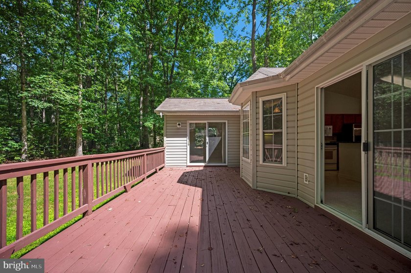 Nestled among mature green trees in the gated Lake of the Woods - photo 32