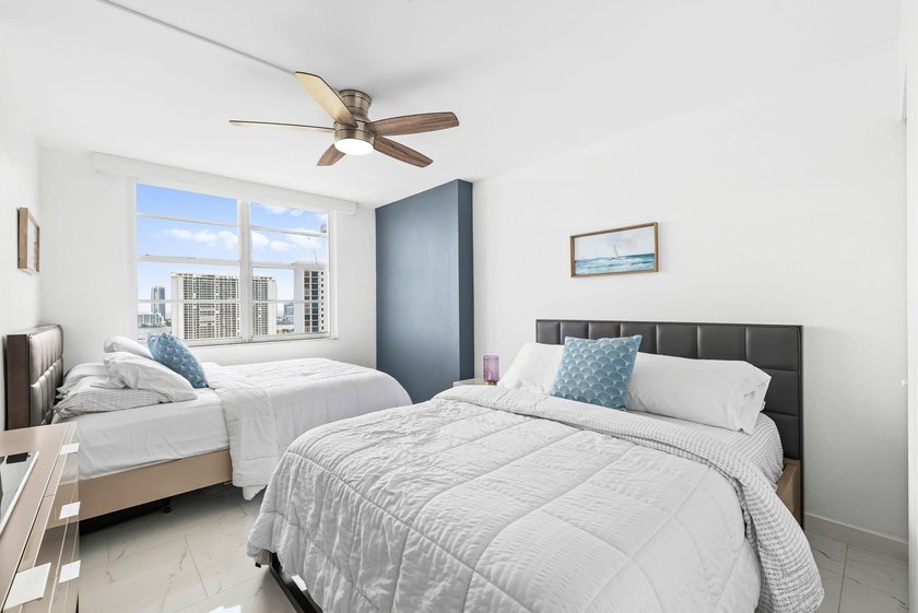 Stunning top-floor corner unit offering breathtaking wraparound - photo 10