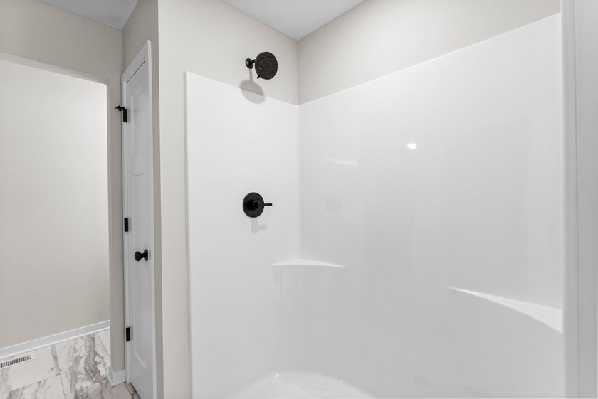 This stunning two-story new construction offers a perfect blend - photo 24