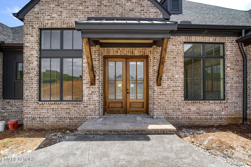 Nearly completed new construction on a premier lakefront - photo 3