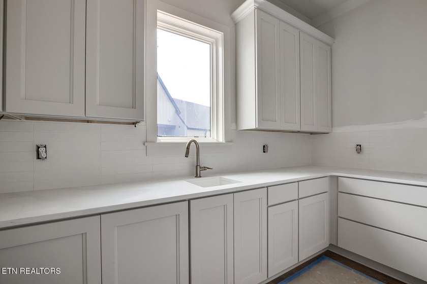 Nearly completed new construction on a premier lakefront - photo 8