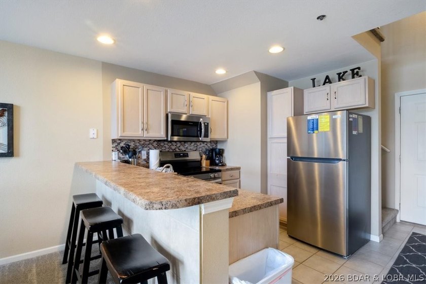This beautifully updated condo sits high above the lake with - photo 11