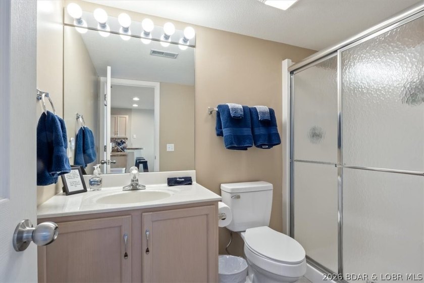 This beautifully updated condo sits high above the lake with - photo 13