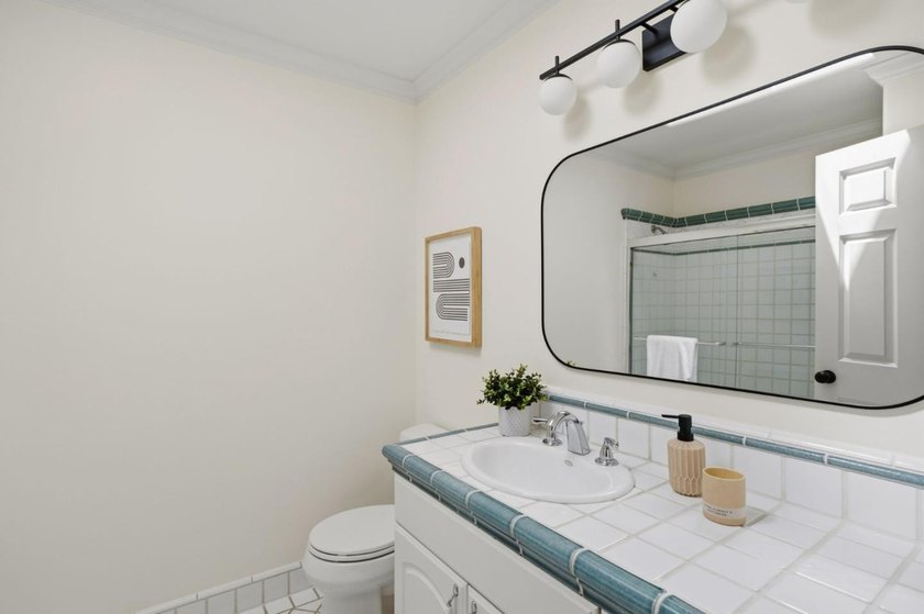 Situated on a picturesque tree-lined street and located down a - photo 24
