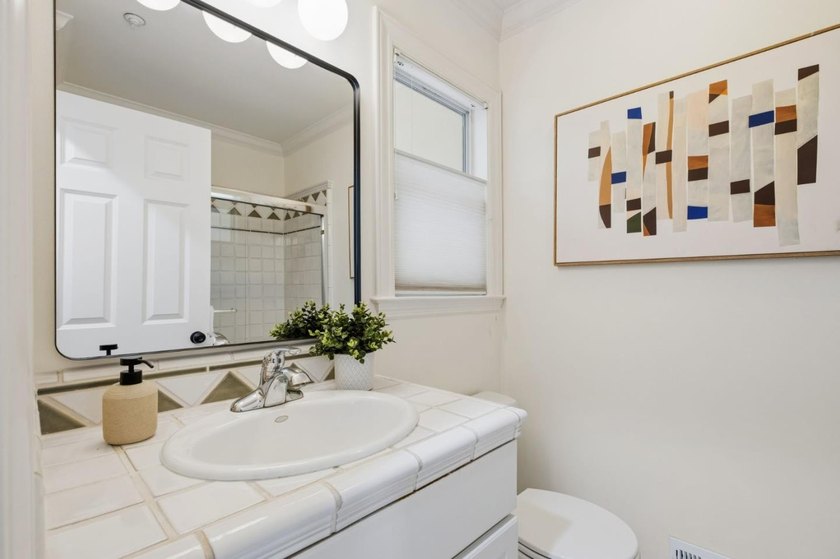 Situated on a picturesque tree-lined street and located down a - photo 27