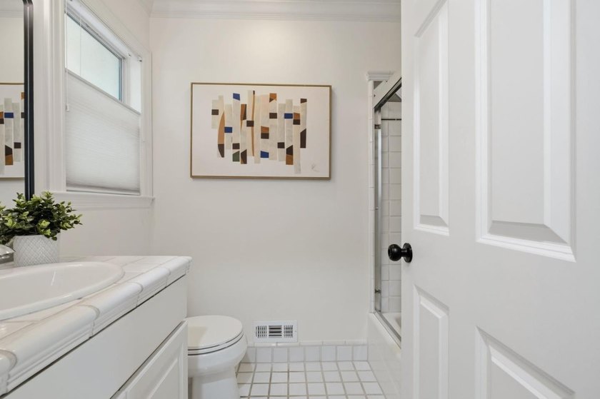 Situated on a picturesque tree-lined street and located down a - photo 28