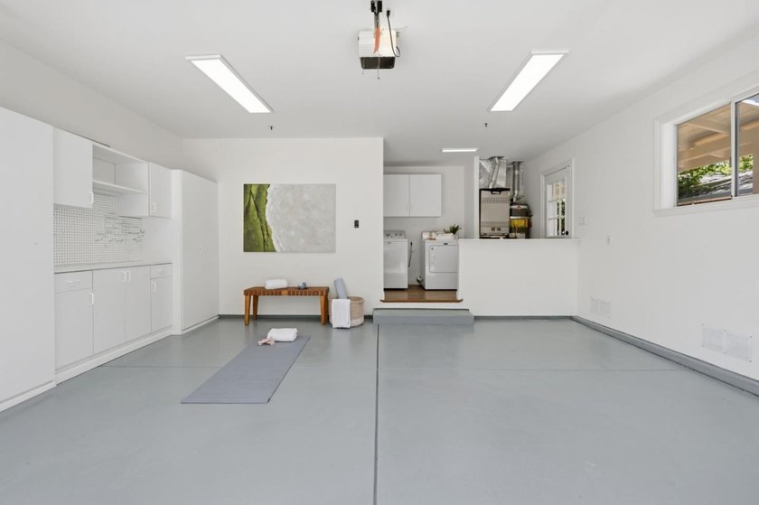 Situated on a picturesque tree-lined street and located down a - photo 33