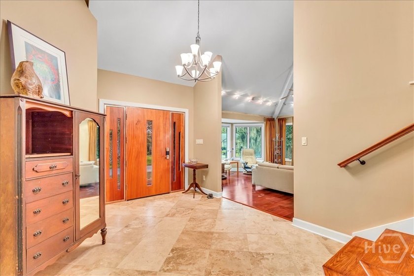 This inviting 5-bedroom, 3-bath all-brick home sits on just - photo 4