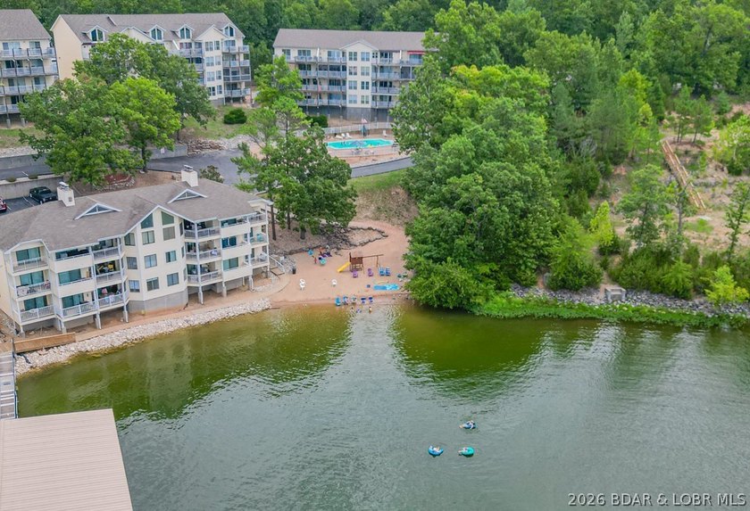 This beautifully updated condo sits high above the lake with - photo 35