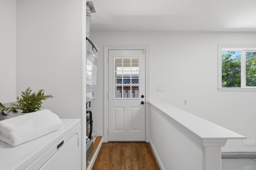 Situated on a picturesque tree-lined street and located down a - photo 35