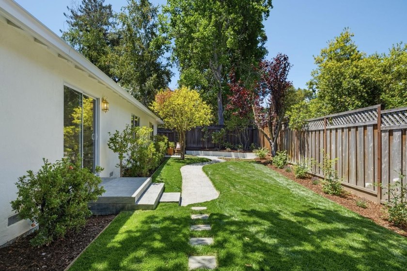 Situated on a picturesque tree-lined street and located down a - photo 38