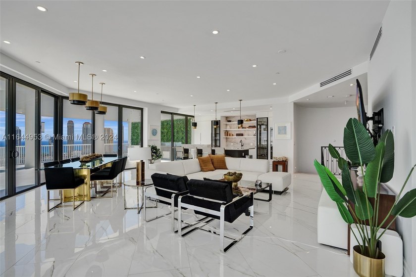 SPECTACULAR, FULLY REMODELED 2 STORY PENTHOUSE HOME OVERLOOKING - photo 2