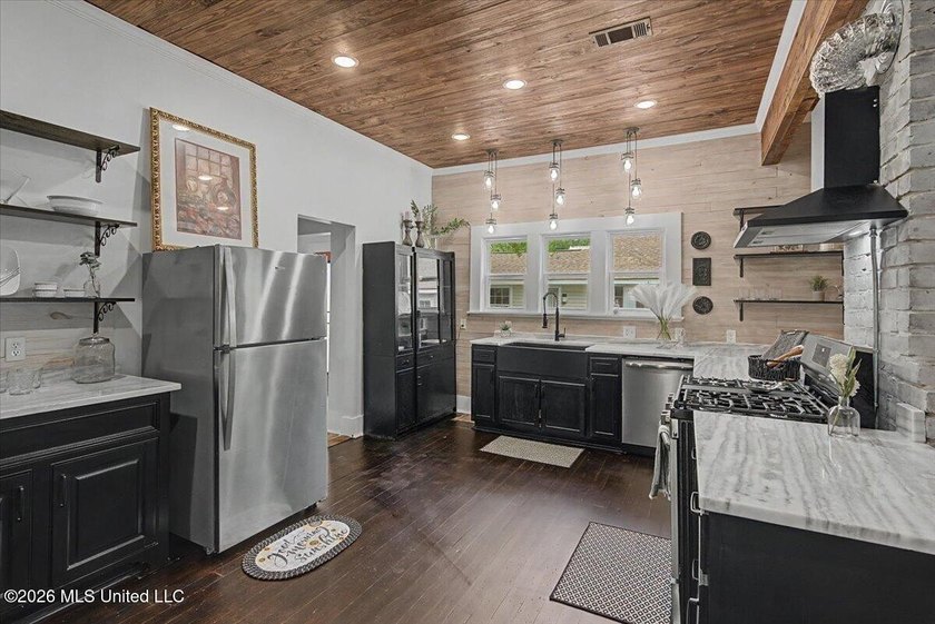 This beautifully renovated home combines modern luxury with - photo 6