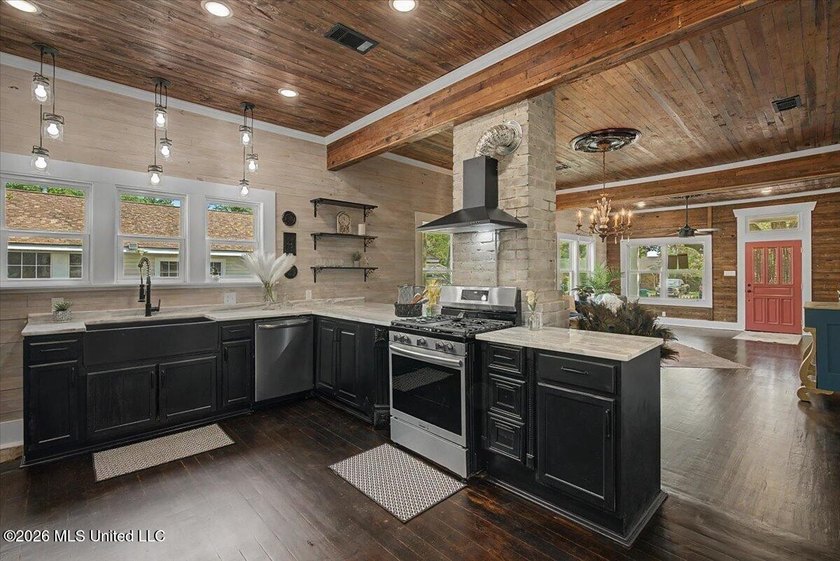 This beautifully renovated home combines modern luxury with - photo 8