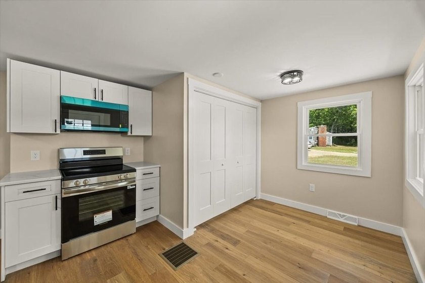 Fully renovated and move-in ready, this charming 2-bedroom home - photo 3
