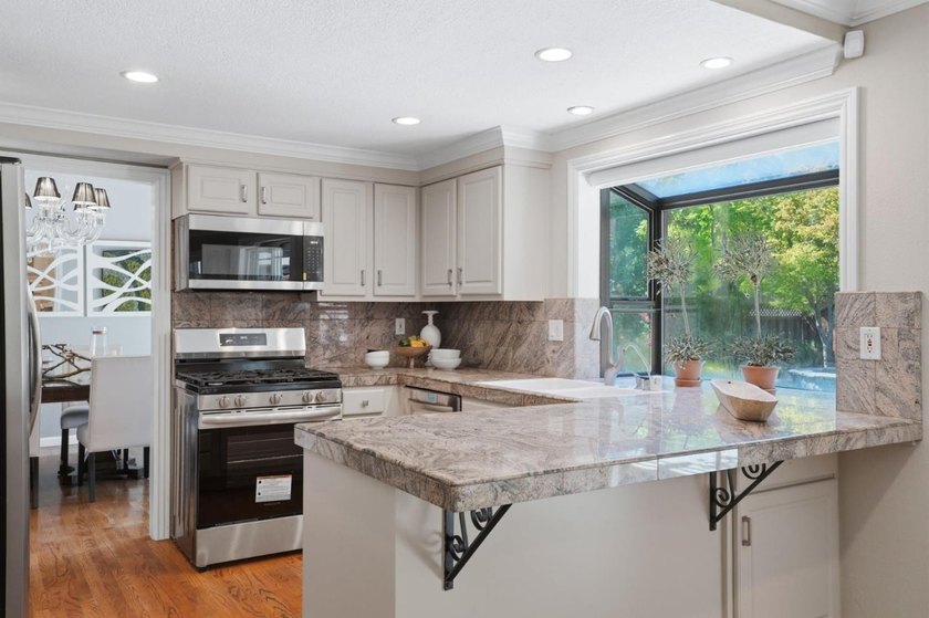PRIZED CORNER LOT WITH STUNNING REMODEL IN SERENE ALMADEN | - photo 11