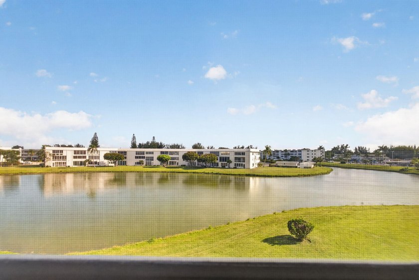 Serene lake views from the balcony highlight this 2/2 floor plan - photo 21