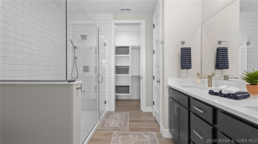 UPSCALE LAKEFRONT CONDO! Discover style with this 2023-built - photo 19