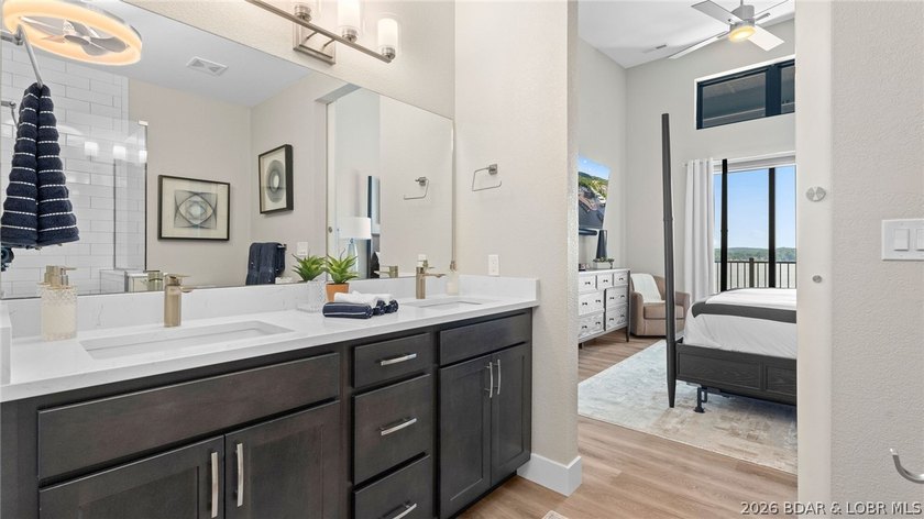 UPSCALE LAKEFRONT CONDO! Discover style with this 2023-built - photo 26