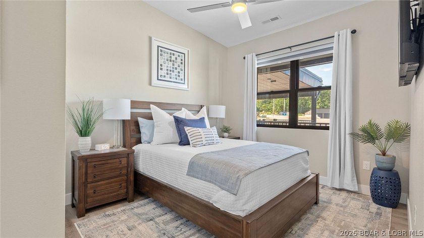 UPSCALE LAKEFRONT CONDO! Discover style with this 2023-built - photo 29