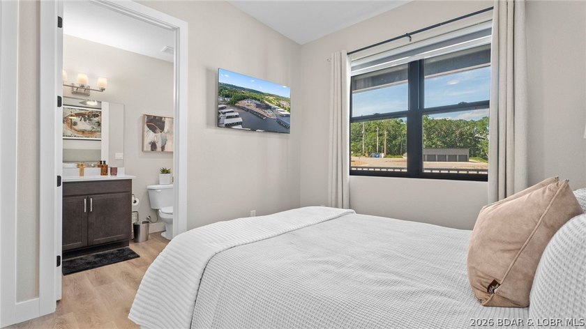 UPSCALE LAKEFRONT CONDO! Discover style with this 2023-built - photo 33