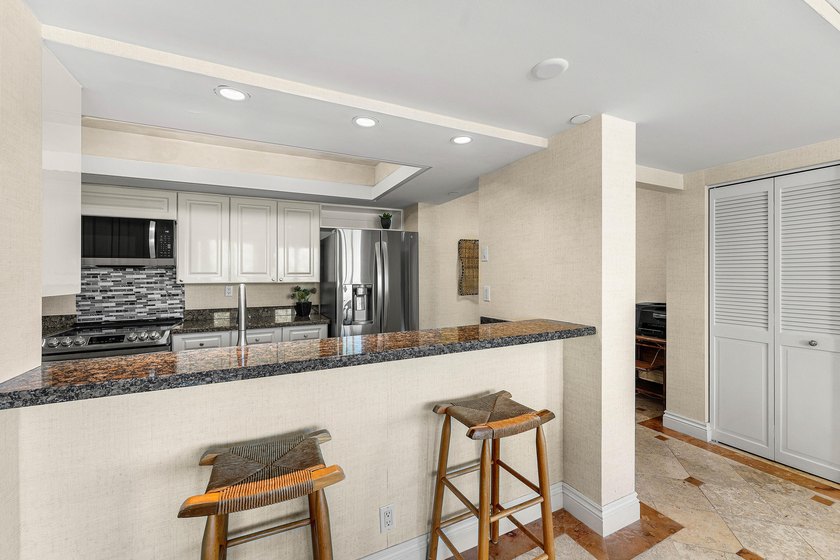 Welcome to the exclusive waterfront community of Mizner Court in - photo 17