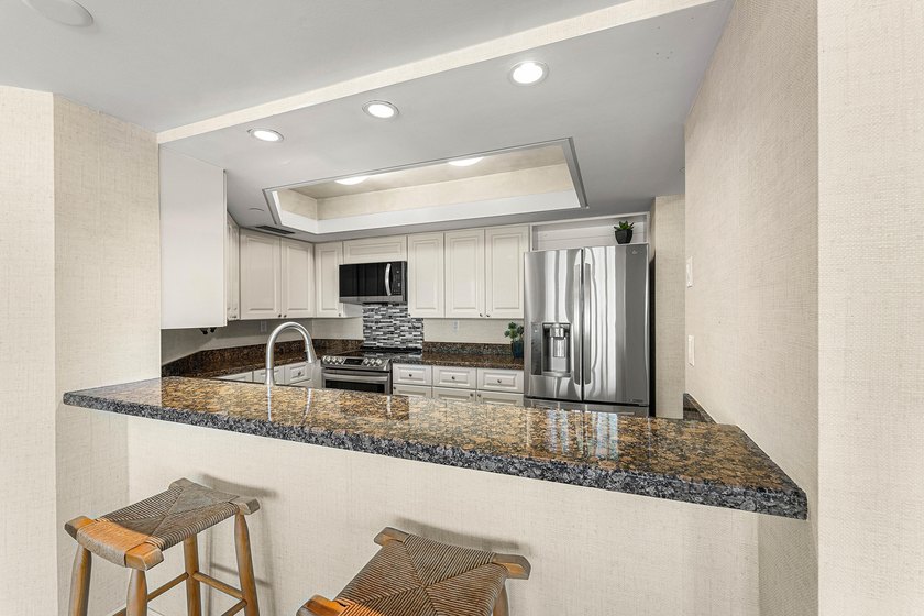 Welcome to the exclusive waterfront community of Mizner Court in - photo 19