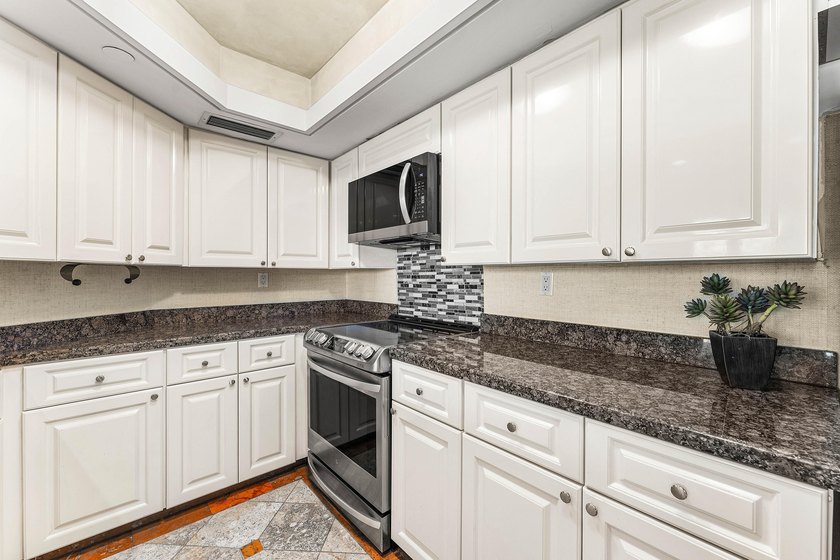 Welcome to the exclusive waterfront community of Mizner Court in - photo 21