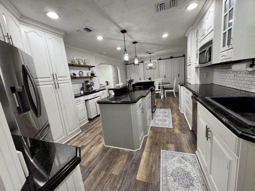 Welcome home! A rare opportunity in the heart of the Palm Beach - photo 7
