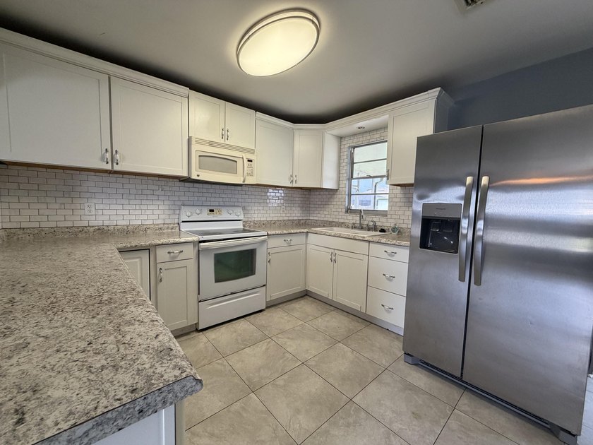 Check out this charming 2 bed, 2 bath home with many unique - photo 3