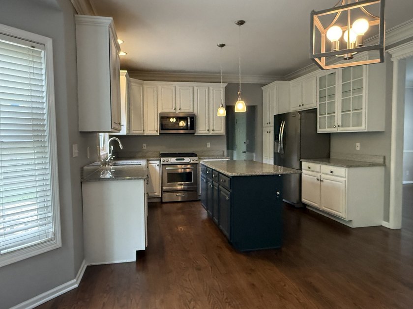 This Colonial style residence presents four bedrooms and two and - photo 11