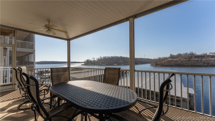 Huge screened deck, 12x32 boat slip with 8,000 lb lift, and rare - photo 25
