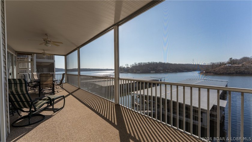 Huge screened deck, 12x32 boat slip with 8,000 lb lift, and rare - photo 26